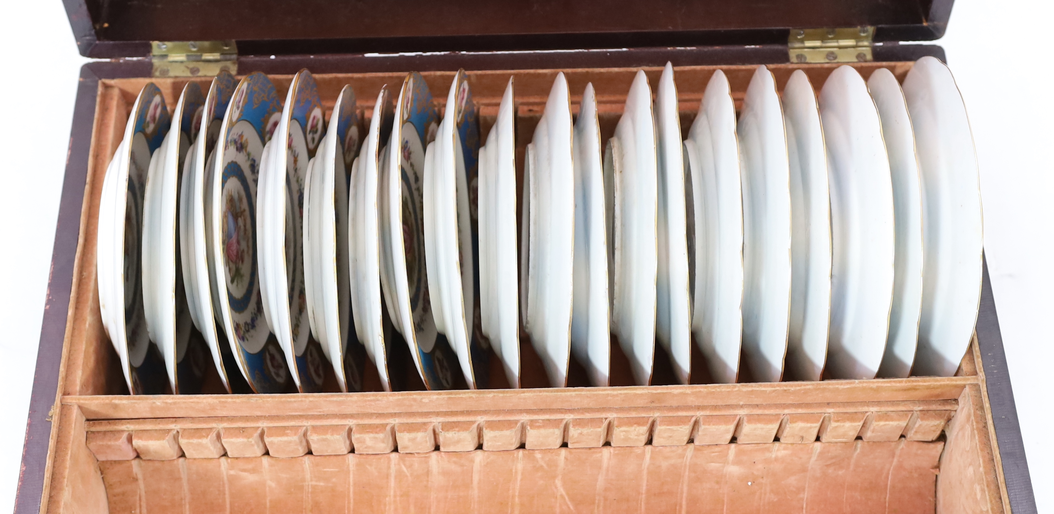 A cased set of twenty four Sevres style cabinet plates, 19th century